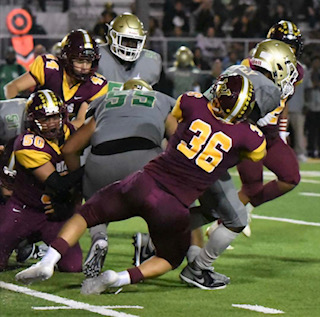 Dowgiewicz, number 36, tackles a Cabrillo player at Wilsons away game 09/27/19