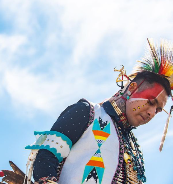 A lone dancer stares to the ground at CSULBs Annual Powwow