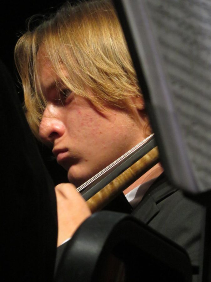 Cellist Stratton Keele (junior, WAVE) is focused while performing a piece in the Advanced Chamber Orchestra, the highest ranked orchestral group at Wilson.
