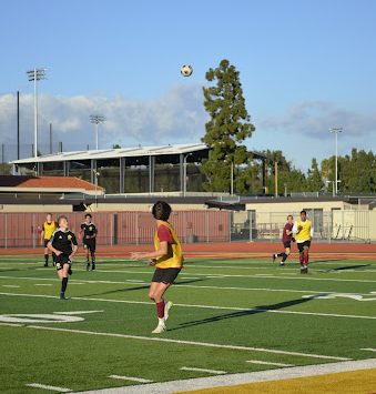 Miles Frazier prepares himself to take possession of the ball as it soars across the field to him.