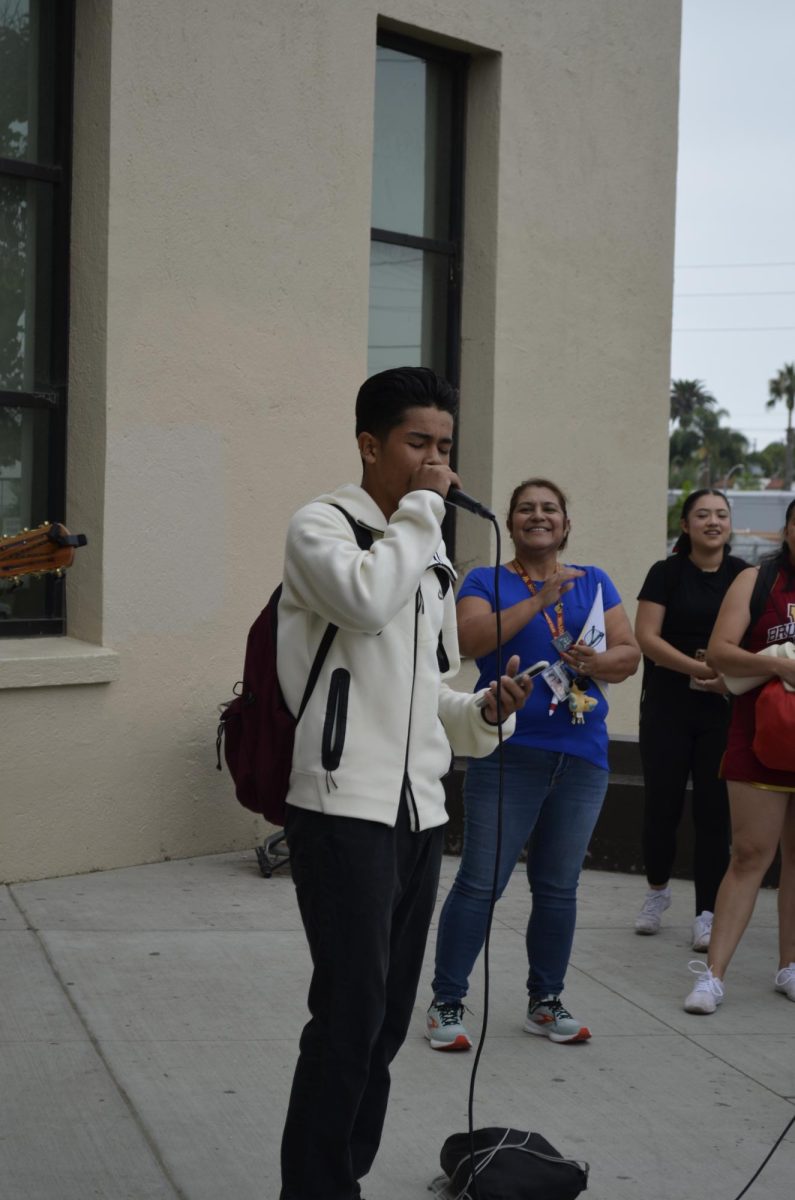 Angel Ortiz performed at the Hispanic Heritage Month morning gathering in front of the school as an unexpected mariachi singer.
